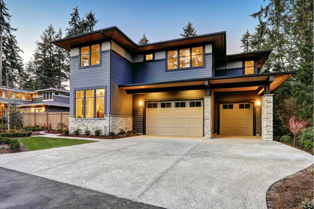 Modern luxury home exterior at dusk