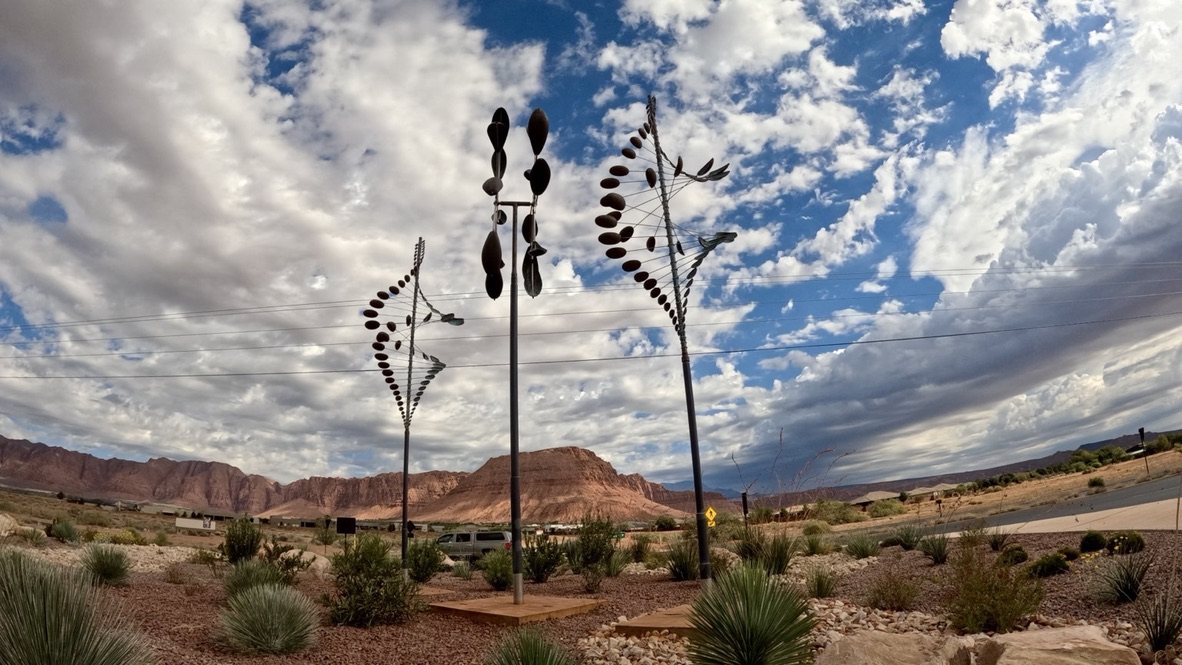 Kinetic wind sculptures under a cloudy sky in Kayenta, Ivins, Utah